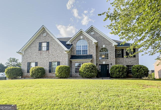 184 Fashion Xing, Mcdonough, GA 30252 - view of front of house featuring a front lawn and brick siding