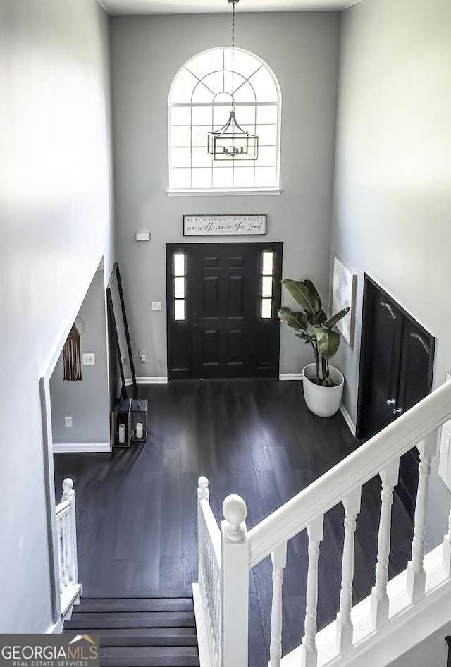 184 Fashion Xing, Mcdonough, GA 30252 - foyer entrance featuring wood finished floors, a high ceiling, and stairs