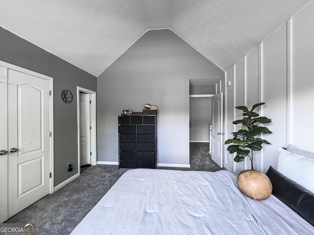 184 Fashion Xing, Mcdonough, GA 30252 - carpeted bedroom with vaulted ceiling and baseboards