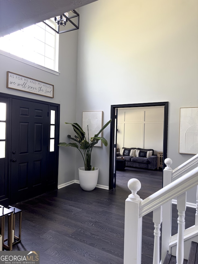 184 Fashion Xing, Mcdonough, GA 30252 - entrance foyer with a towering ceiling, wood finished floors, and a chandelier