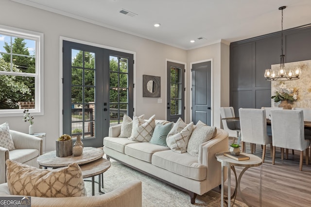 937 Willingham Dr Unit 7, Hapeville, GA 30354 - living room featuring a chandelier, french doors, ornamental molding, wood finished floors, and recessed lighting