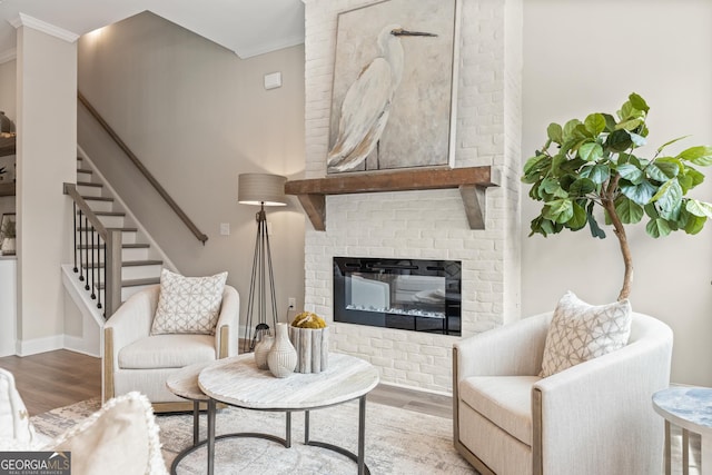 937 Willingham Dr Unit 7, Hapeville, GA 30354 - living area featuring wood finished floors, crown molding, stairs, and a fireplace