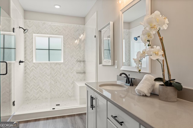 937 Willingham Dr Unit 7, Hapeville, GA 30354 - bathroom featuring vanity, a stall shower, and wood finished floors