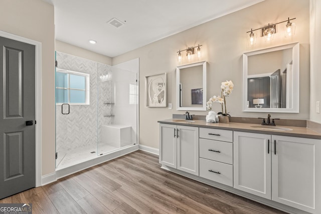 937 Willingham Dr Unit 7, Hapeville, GA 30354 - full bathroom featuring double vanity, wood finished floors, a stall shower, and recessed lighting