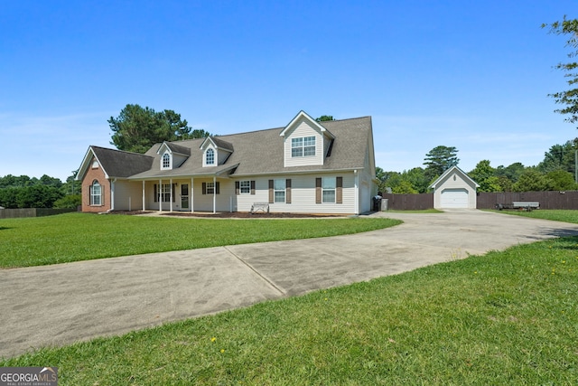 603 Rossie Ct, Mcdonough, GA 30252 - cape cod house with driveway, a porch, a detached garage, and an outdoor structure