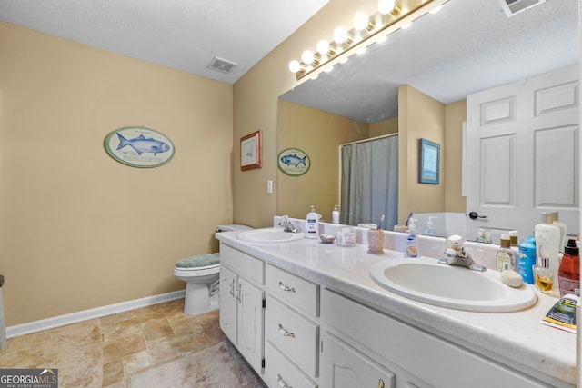603 Rossie Ct, Mcdonough, GA 30252 - bathroom featuring double vanity, curtained shower, and stone finish floors