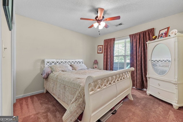603 Rossie Ct, Mcdonough, GA 30252 - bedroom featuring carpet floors, a textured ceiling, and ceiling fan