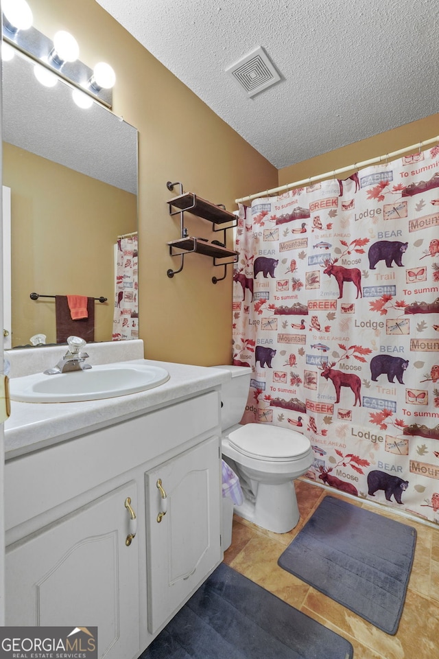 603 Rossie Ct, Mcdonough, GA 30252 - full bath featuring vanity, a textured ceiling, tile patterned floors, and a shower with curtain