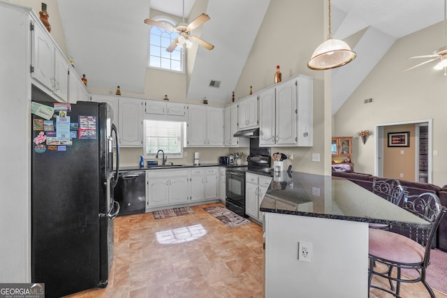 603 Rossie Ct, Mcdonough, GA 30252 - kitchen with black appliances, a ceiling fan, a peninsula, high vaulted ceiling, and a kitchen bar