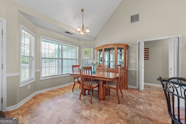603 Rossie Ct, Mcdonough, GA 30252 - dining room with a chandelier and high vaulted ceiling