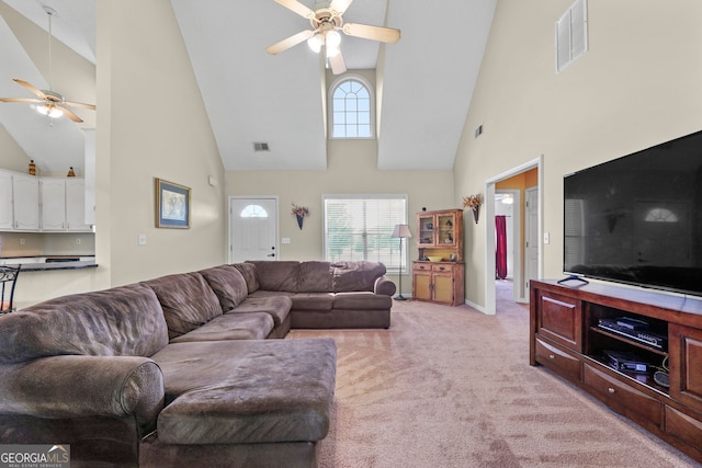 603 Rossie Ct, Mcdonough, GA 30252 - living room featuring a ceiling fan, high vaulted ceiling, and light carpet