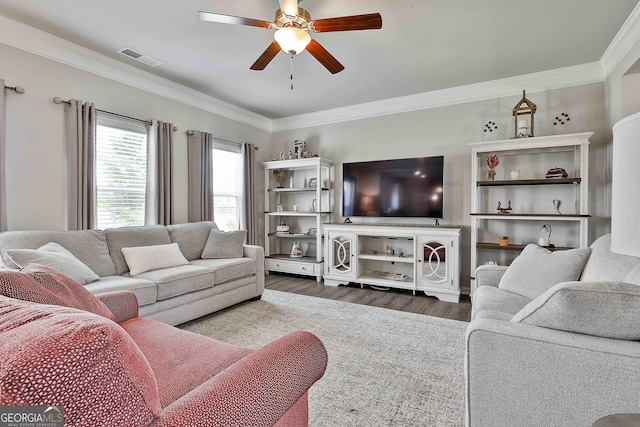 17 October Ave, Newnan, GA 30265 - living room with dark wood finished floors, ceiling fan, and ornamental molding