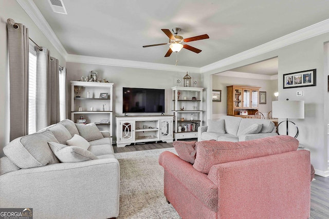 17 October Ave, Newnan, GA 30265 - living area featuring wood finished floors, ceiling fan, and crown molding