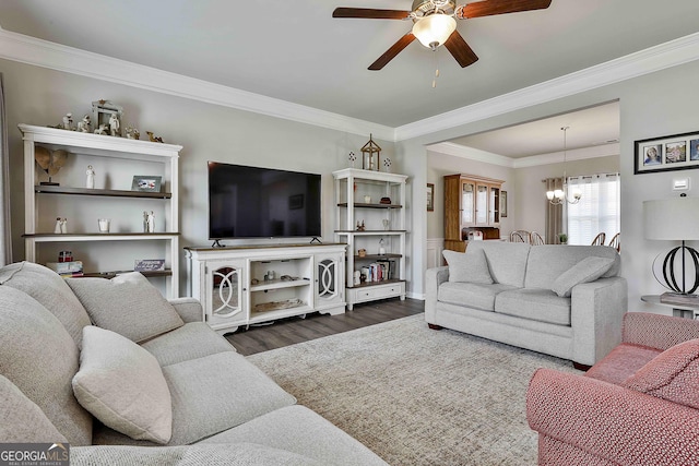 17 October Ave, Newnan, GA 30265 - living area featuring a ceiling fan, dark wood-style flooring, a chandelier, and ornamental molding