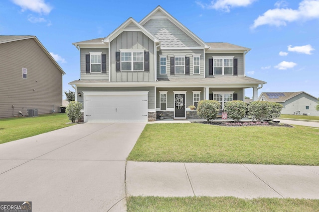 17 October Ave, Newnan, GA 30265 - craftsman-style house with board and batten siding, a garage, concrete driveway, a front yard, and covered porch