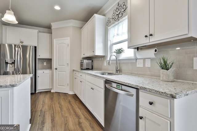 17 October Ave, Newnan, GA 30265 - kitchen featuring stainless steel appliances, decorative backsplash, white cabinetry, dark wood-style floors, and recessed lighting