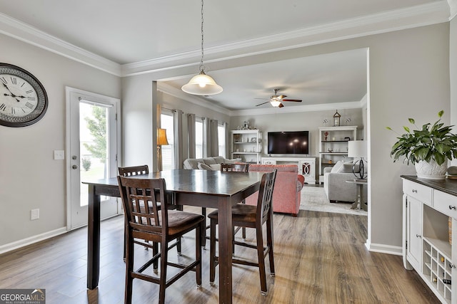 17 October Ave, Newnan, GA 30265 - dining area featuring healthy amount of natural light, ceiling fan, dark wood finished floors, and crown molding