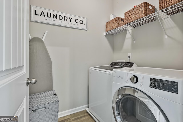 17 October Ave, Newnan, GA 30265 - washroom featuring separate washer and dryer and wood finished floors