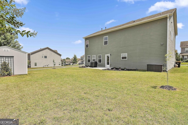 17 October Ave, Newnan, GA 30265 - rear view of house with a lawn, a patio area, and an outdoor structure