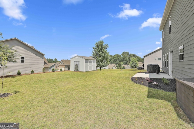 17 October Ave, Newnan, GA 30265 - view of green lawn with a patio and a storage shed