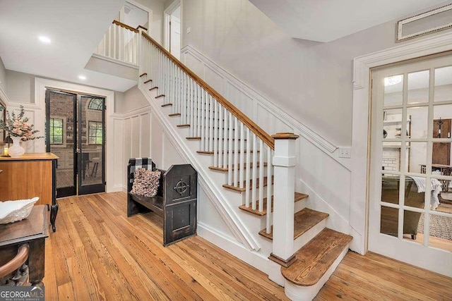 106 Draughons Dr, Saint Simons, GA 31522 - stairs featuring hardwood / wood-style flooring, a decorative wall, and recessed lighting