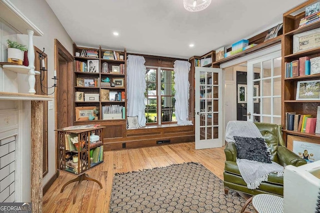 106 Draughons Dr, Saint Simons, GA 31522 - living area featuring french doors and wood finished floors
