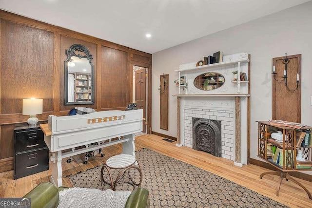 106 Draughons Dr, Saint Simons, GA 31522 - living area featuring light wood finished floors and a fireplace