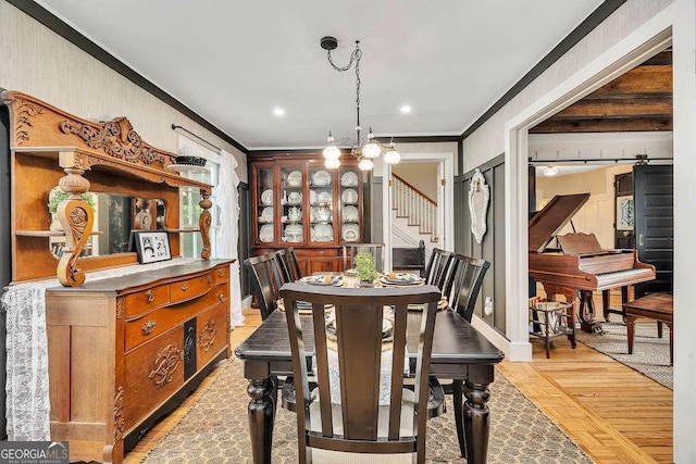 106 Draughons Dr, Saint Simons, GA 31522 - dining room featuring crown molding, stairs, a chandelier, light wood-style floors, and recessed lighting