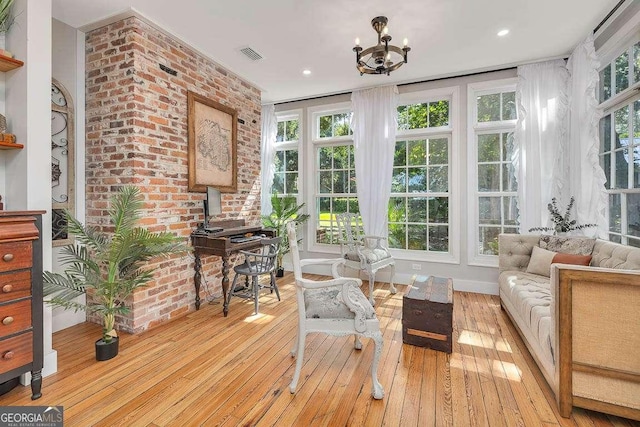 106 Draughons Dr, Saint Simons, GA 31522 - sunroom with plenty of natural light and a chandelier