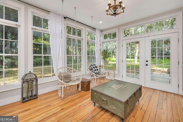 106 Draughons Dr, Saint Simons, GA 31522 - sunroom / solarium with french doors, hardwood / wood-style floors, and a chandelier