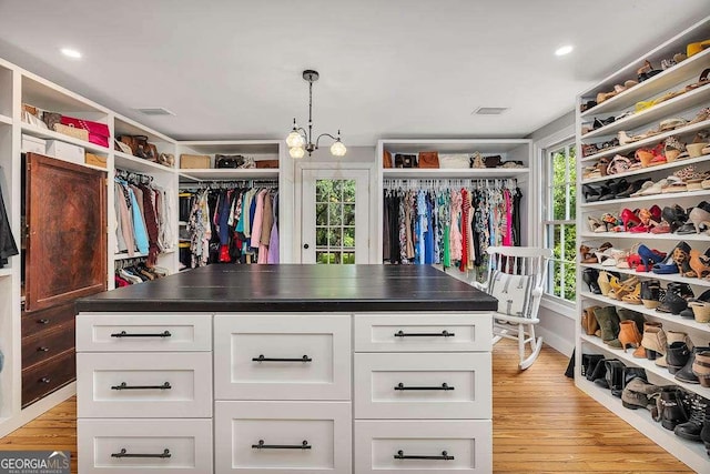 106 Draughons Dr, Saint Simons, GA 31522 - spacious closet featuring light wood-style flooring