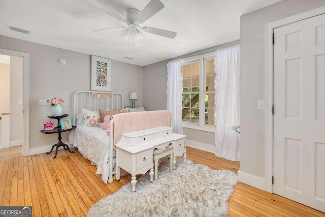 106 Draughons Dr, Saint Simons, GA 31522 - bedroom with light wood finished floors and ceiling fan