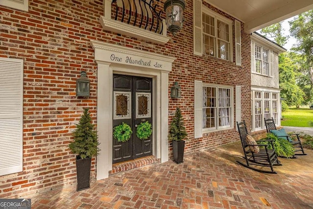 106 Draughons Dr, Saint Simons, GA 31522 - entrance to property with french doors and brick siding