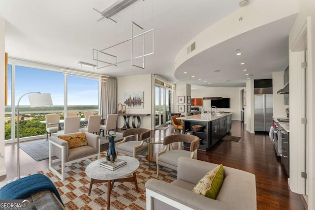 3325 Piedmont Rd NE Unit 2006, Atlanta, GA 30305 - living area featuring dark wood-style floors and floor to ceiling windows