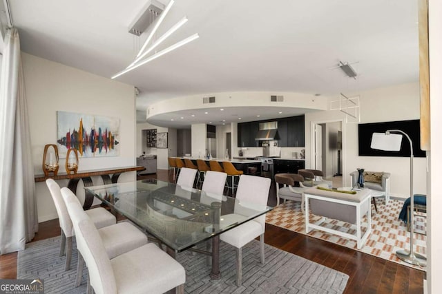 3325 Piedmont Rd NE Unit 2006, Atlanta, GA 30305 - dining area featuring hardwood / wood-style flooring and baseboards