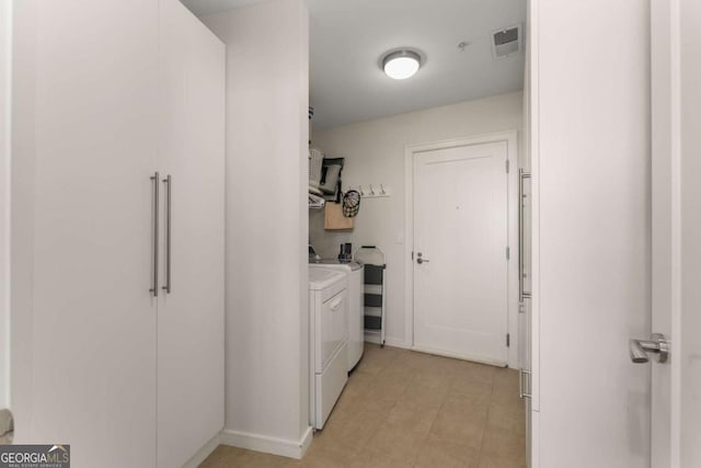 3325 Piedmont Rd NE Unit 2006, Atlanta, GA 30305 - washroom with independent washer and dryer and baseboards