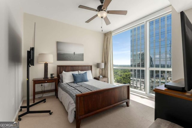 3325 Piedmont Rd NE Unit 2006, Atlanta, GA 30305 - carpeted bedroom featuring a wall of windows and a ceiling fan