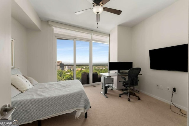 3325 Piedmont Rd NE Unit 2006, Atlanta, GA 30305 - bedroom featuring light colored carpet, a desk, floor to ceiling windows, and a ceiling fan
