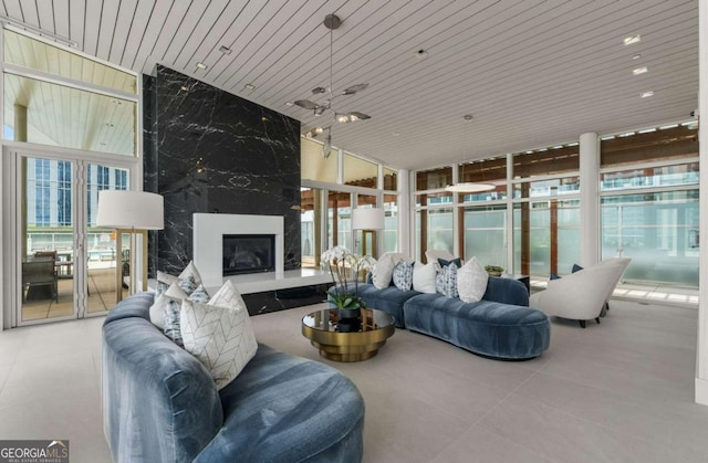 3325 Piedmont Rd NE Unit 2006, Atlanta, GA 30305 - tiled living area with floor to ceiling windows, a high end fireplace, and wooden ceiling