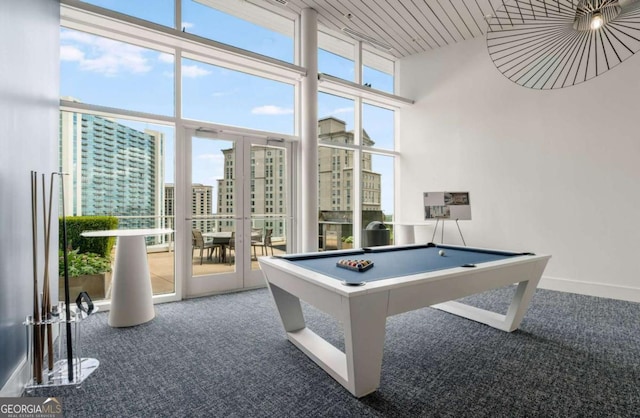 3325 Piedmont Rd NE Unit 2006, Atlanta, GA 30305 - playroom featuring carpet flooring, pool table, a view of city, a high ceiling, and wooden ceiling
