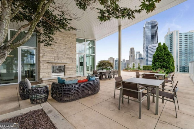 3325 Piedmont Rd NE Unit 2006, Atlanta, GA 30305 - view of patio / terrace featuring outdoor dining space, a skyline view, and an outdoor hangout area