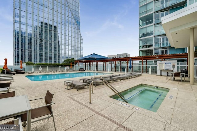 3325 Piedmont Rd NE Unit 2006, Atlanta, GA 30305 - community pool featuring a hot tub and a patio area