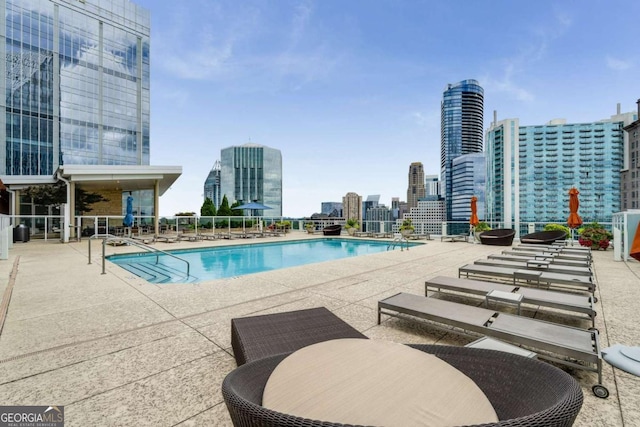 3325 Piedmont Rd NE Unit 2006, Atlanta, GA 30305 - community pool featuring a skyline view and a patio