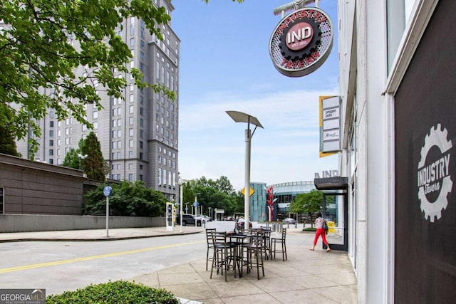 3325 Piedmont Rd NE Unit 2006, Atlanta, GA 30305 - view of asphalt road featuring sidewalks, street lighting, curbs, and traffic signs
