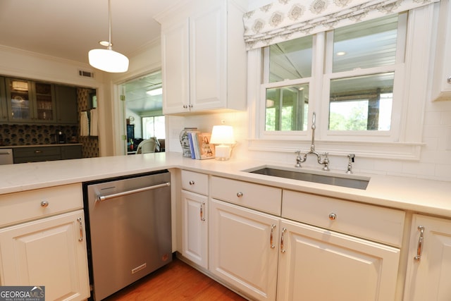8 Crepe Myrtle, Newnan, GA 30263 - kitchen with dishwasher, backsplash, light countertops, healthy amount of natural light, and crown molding