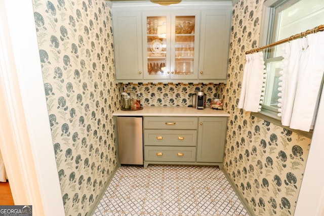 8 Crepe Myrtle, Newnan, GA 30263 - kitchen featuring wallpapered walls, light countertops, green cabinets, refrigerator, and glass insert cabinets