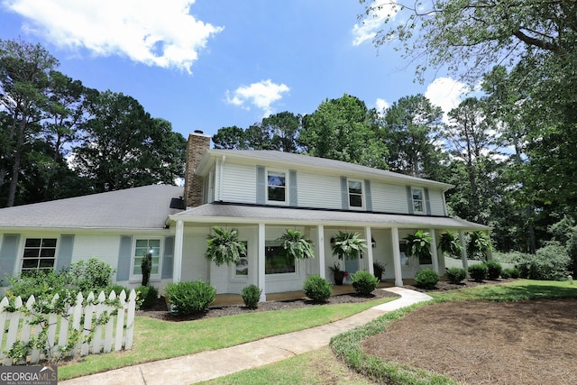 8 Crepe Myrtle, Newnan, GA 30263 - view of front of house with a chimney and covered porch
