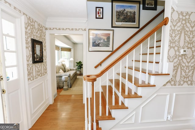 8 Crepe Myrtle, Newnan, GA 30263 - stairway with wallpapered walls, wainscoting, a decorative wall, and wood finished floors