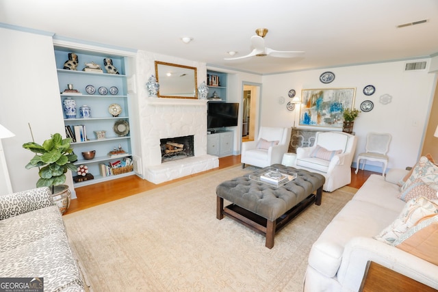 8 Crepe Myrtle, Newnan, GA 30263 - living area with a stone fireplace and light wood-type flooring
