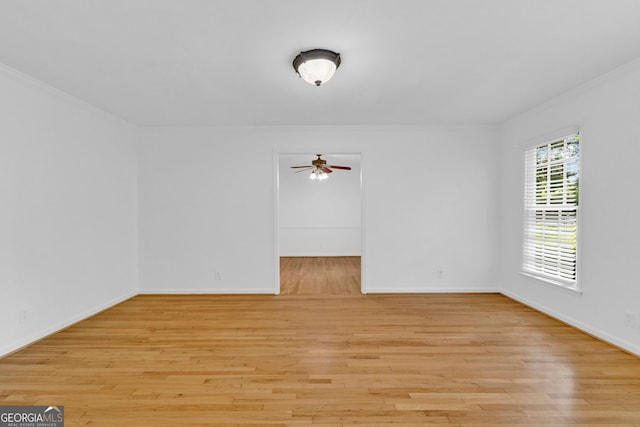 1590 Sunnybrook Farm Rd, Atlanta, GA 30350 - spare room featuring ornamental molding, a ceiling fan, and light wood-style floors